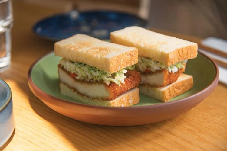 Kisser signature dishes Tamago Sando (Egg Salad Sandwich), Pork Katsu Sando, Onigiri (Rice Balls), Udon Noodles